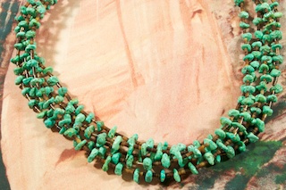 Beautiful 5 Strand Necklace featuring Genuine Turquoise Accented with Pen Shell Heishi. Sterling Silver Cones and Clasp. Created by Santo Domingo Artist Carol Pacheco.